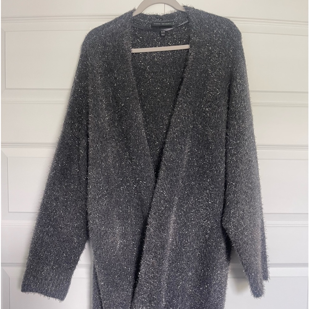 Gray Sweater jacket.  Open front w/Sparkly gray metallic.  No zipper or buttons